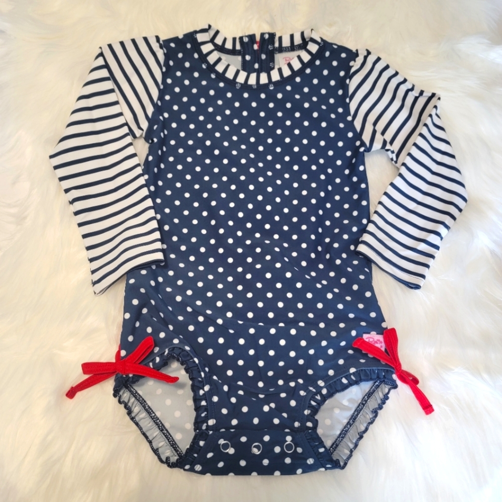 Ruffle Butts girls swimsuit, long sleeve one piece, red white & blue with bows